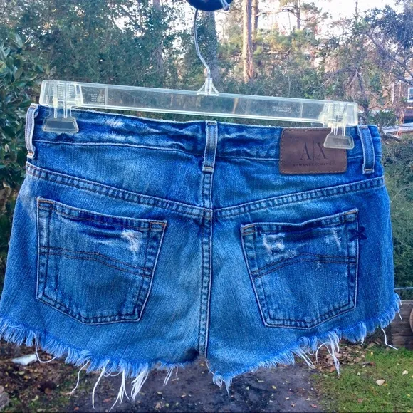 ARMANI EXCHANGE CHOPPER light indigo cutoffs.