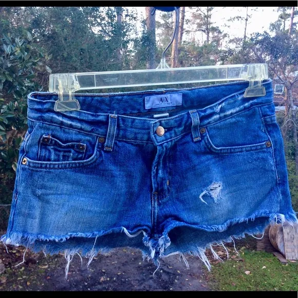 ARMANI EXCHANGE CHOPPER light indigo cutoffs.