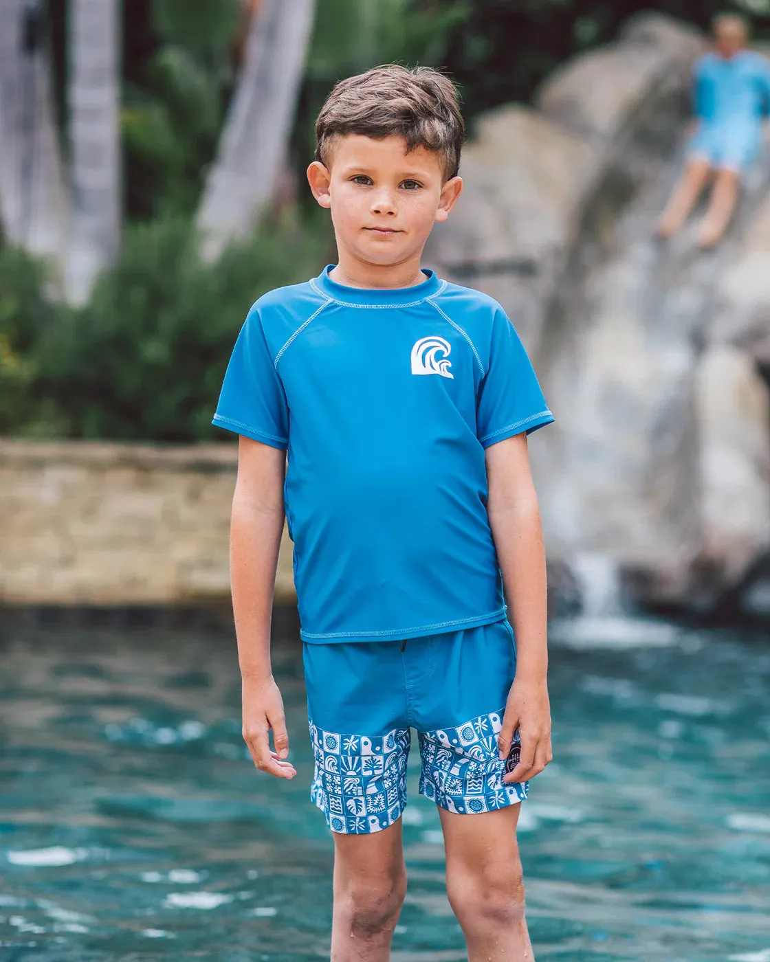FEATHER 4 ARROW- KIDS BEACH TILE BOARD SHORTS
