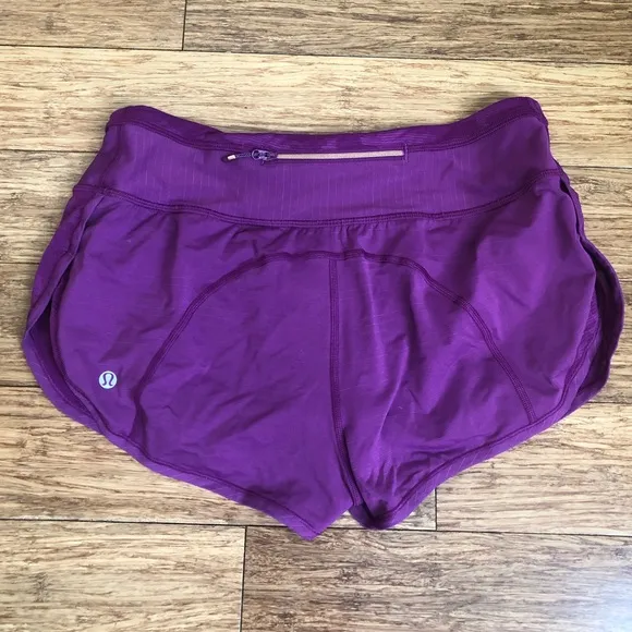 Lululemon Run For Days Short in Regal Plum with a gold zipper
